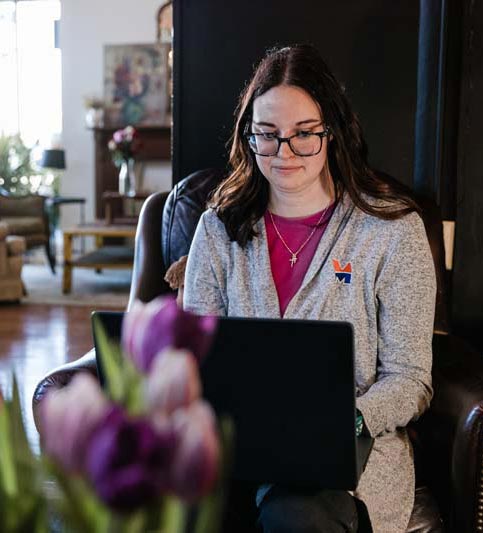 Graduate student working on laptop