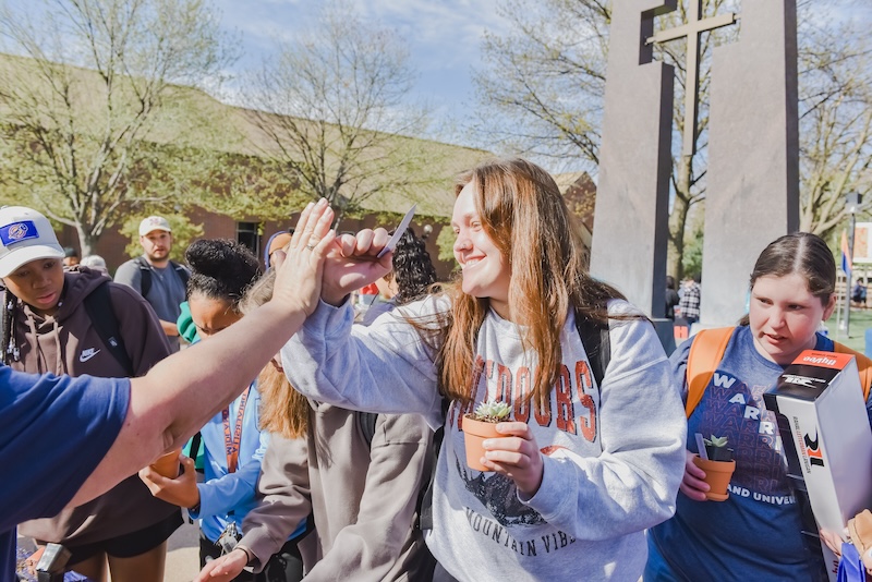 Midland University Students Walking Across Campus